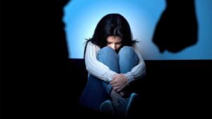 girl crawled up in a ball and in distress