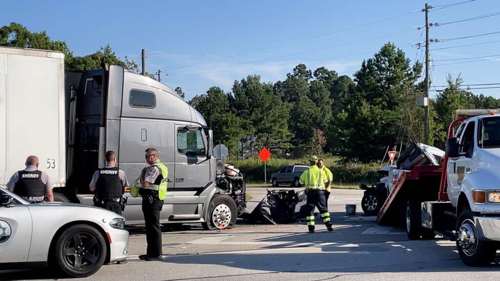 Augusta, Ga USA - 09 23 2021: Semi truck and pickup truck collision car wreck and Police officers on scene on Highway 1